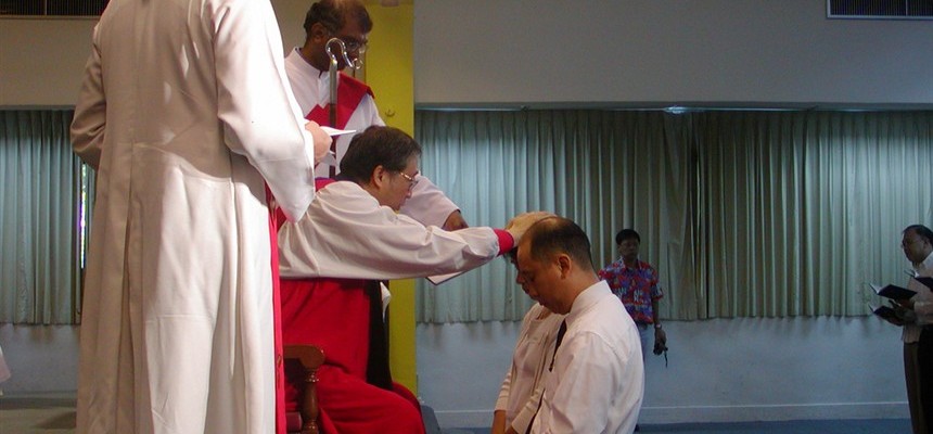 sacrament of confirmation laying on of hands